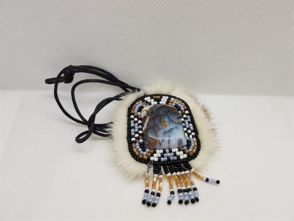 Amulet of rare landscape agate, beads and fur on a cord
